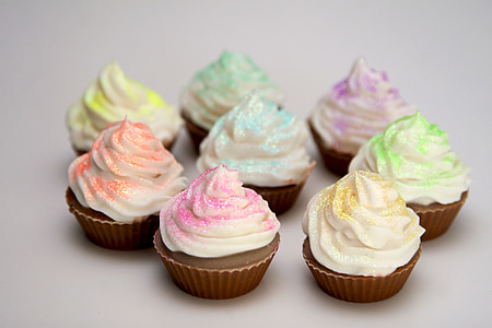 eight cupcakes on white surface