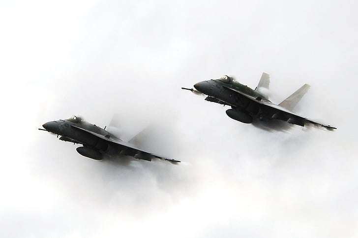 two flying fighter jets