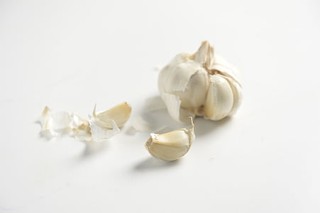 garlic clover on white surface