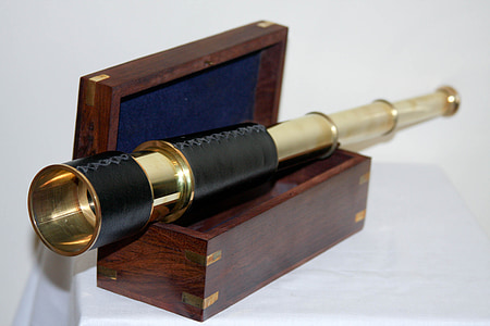 black and gold-colored retractable telescope with box