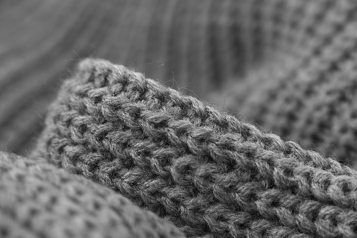 grayscale photography of knit textile