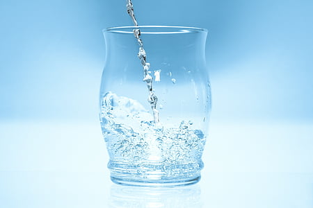 water poured on clear drinking glass