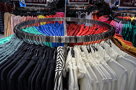 assorted-color clothes on steel rack