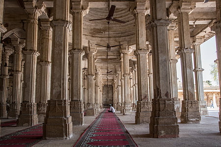 photo of red carpet in between of concrete pillars