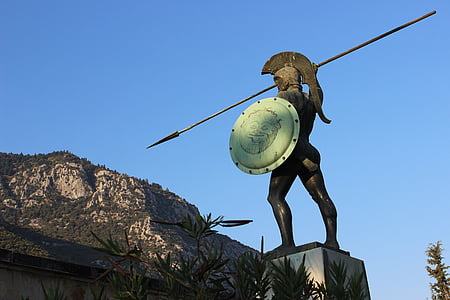 spartan statue facing mountains