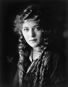 grayscale photography of woman with curly hair