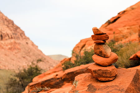 photo of pile of rocks on mountain slope