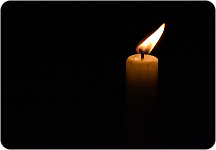 photo of lighted candle