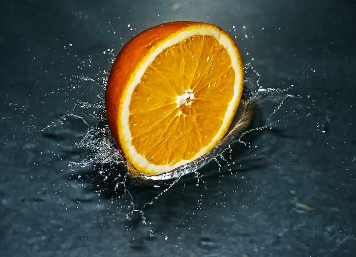 sliced orange citrus fruit on water