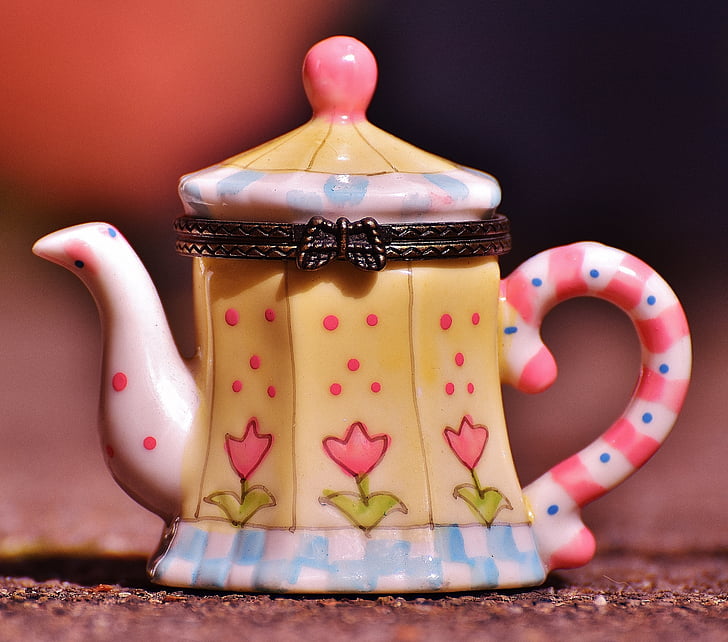beige and white ceramic teapot container