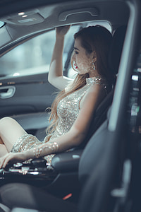 woman sitting on vehicle seat
