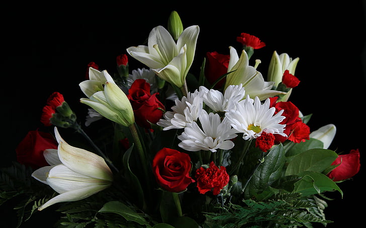 white lilies, chrysanthemum, and red roses arrangement
