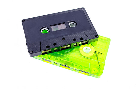 two green-and-black cassette tapes