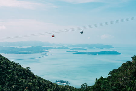 two cable cars on top of beach