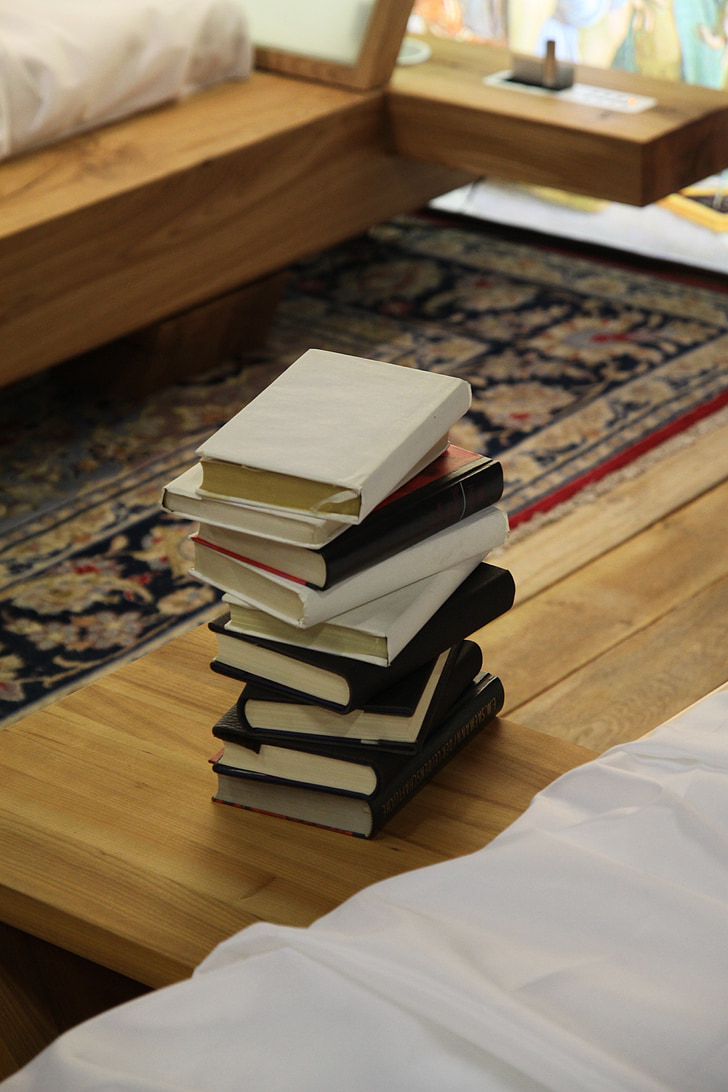 photo of piled books on table