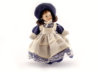 beige and purple porcelain doll