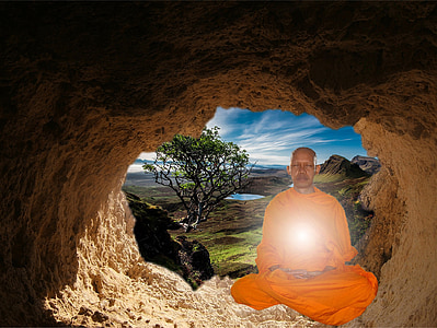 edited photo of monk inside the cave during daytime