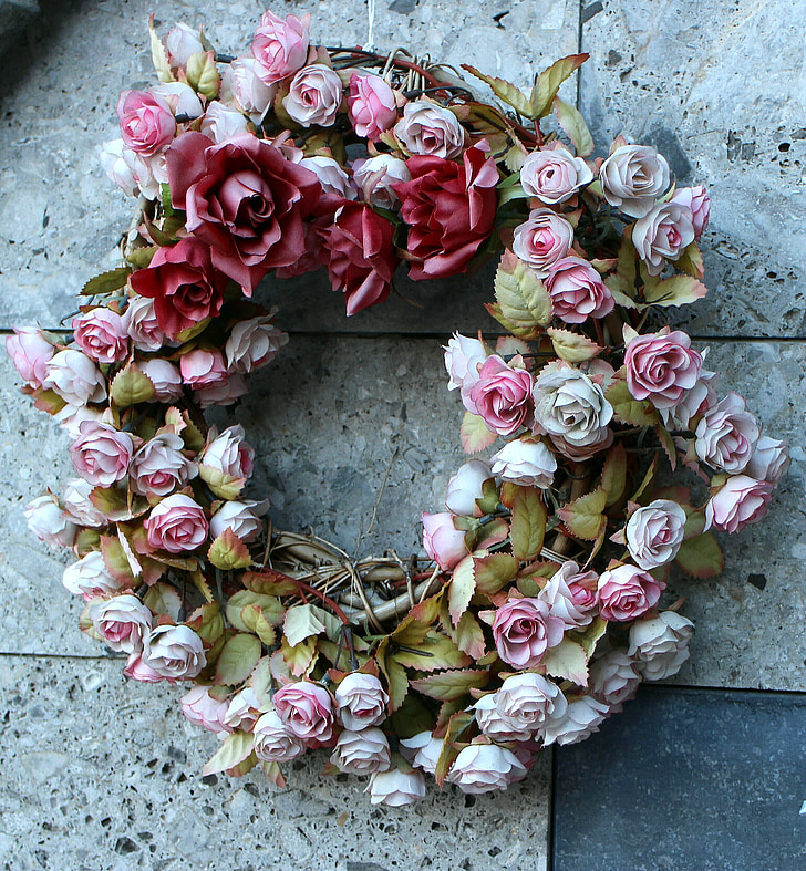 pink and red rose wreath on floor