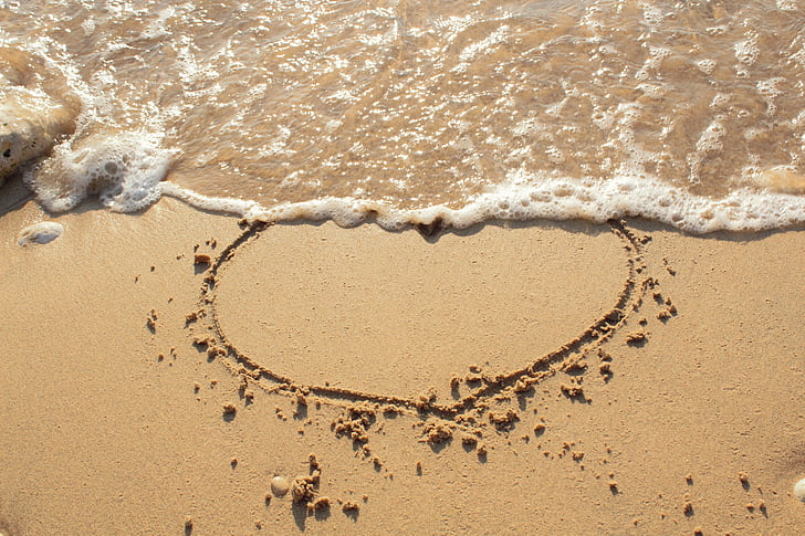 heart on beach sand