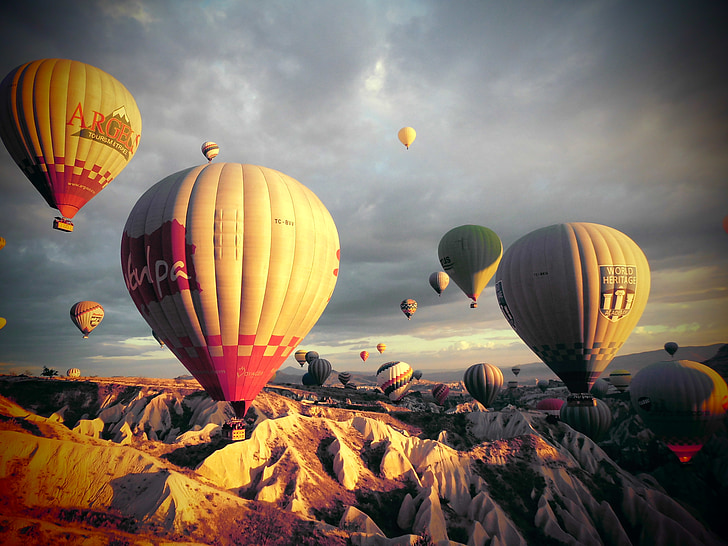 flying hot air balloons during daytime