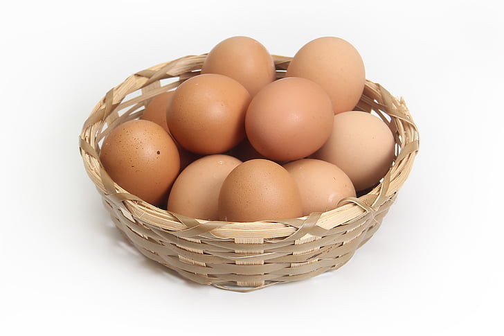 brown egg lot on beige wicker basket