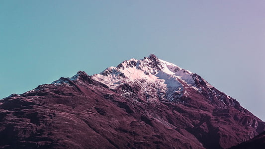 snow-capped mountain under clear sky