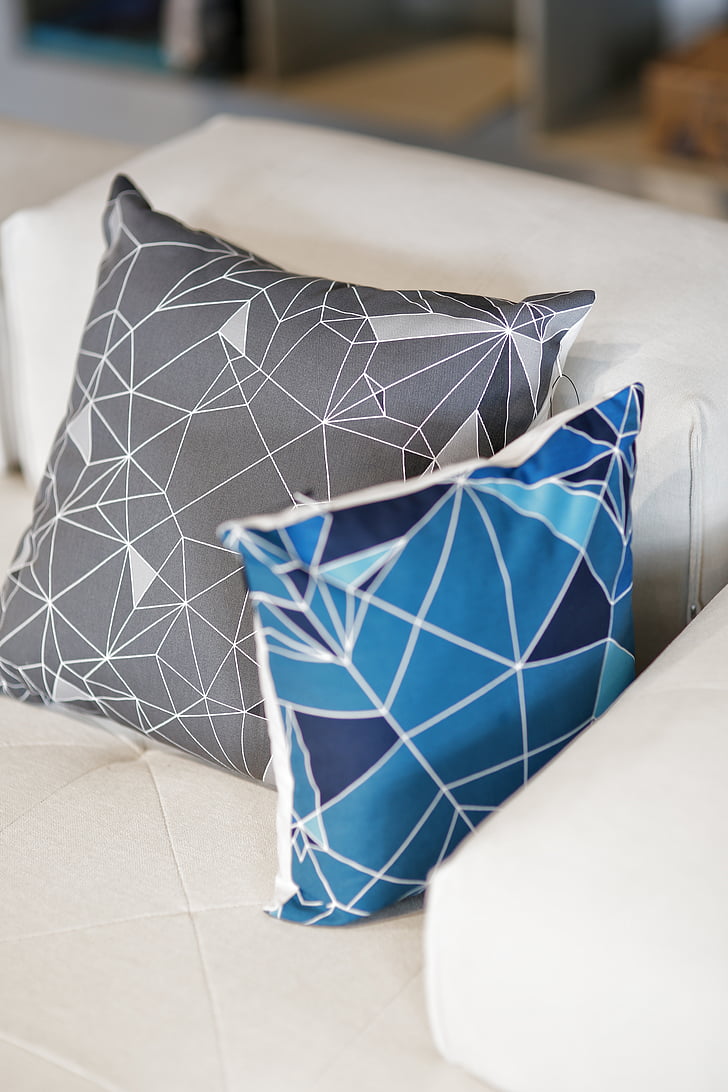 two gray and blue throw pillows