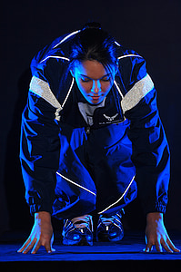 close-up photograph of woman wearing blue zip-up jacket
