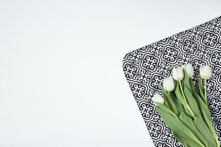 white flowers on white and black surface
