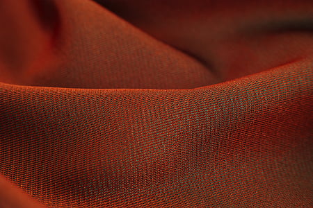 macro photography of red textile