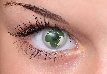 closeup photo of person wearing america continent contact lens