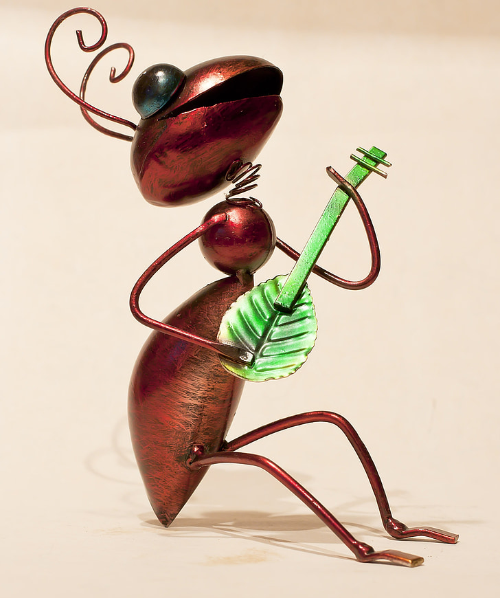 ant playing leaf guitar figurine