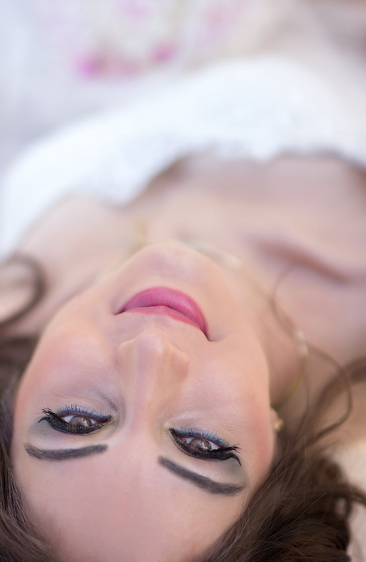 shallow focus photography of woman laying