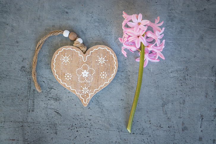 brown heart wooden decor near pink flower
