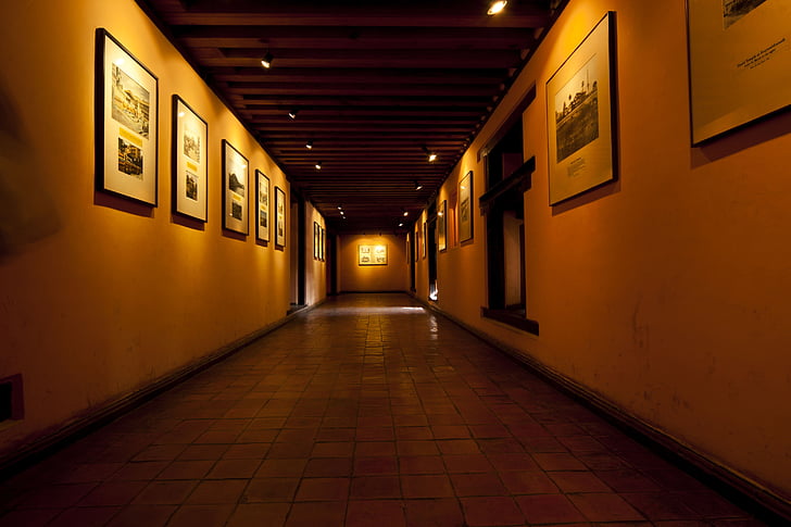 well-lit hallway with photo framed photos