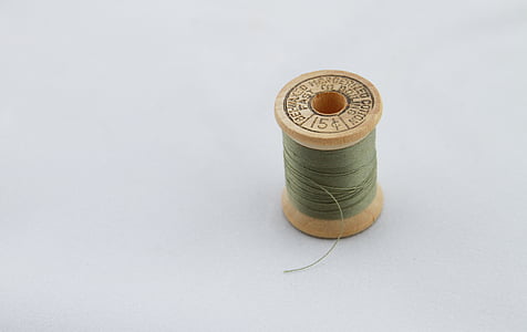 photo of green thread spool