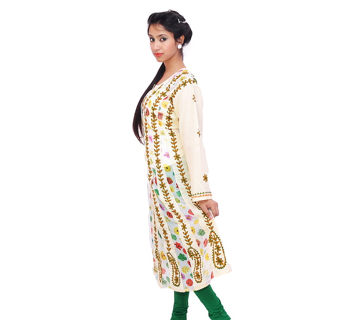 woman wearing white and green tunic dress and pants