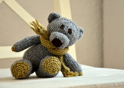 grey teddy bear plush toy on brown chair
