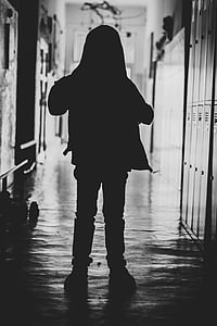 silhouette of person standing on floor