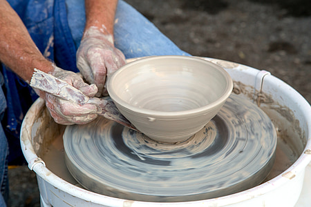 person makin pottery