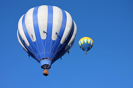 two hot air balloons under blue sky