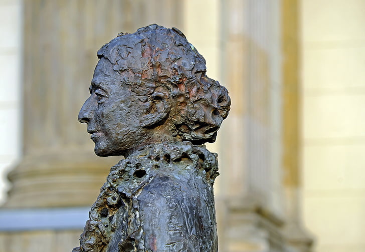focus photography of woman statue