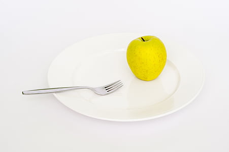 white ceramic plate with silver fork