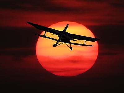 silhouette photography of monoplane