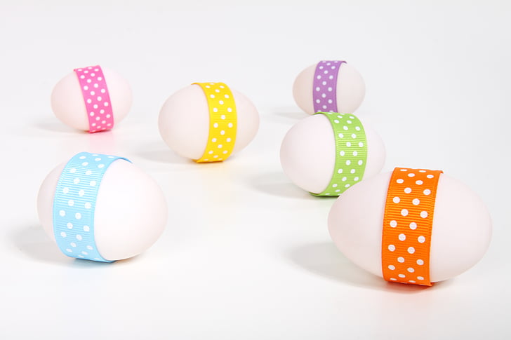 six eggs with polka-dot straps