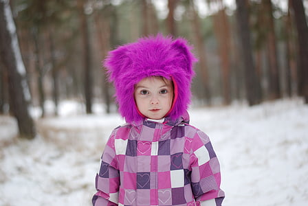 toddler wearing purple hat