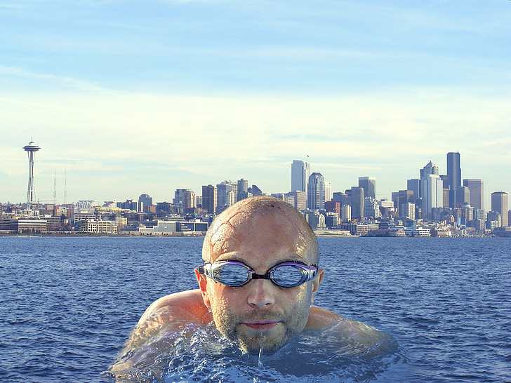 man on body of water facing camera