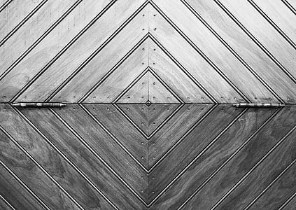 grayscale photo of door