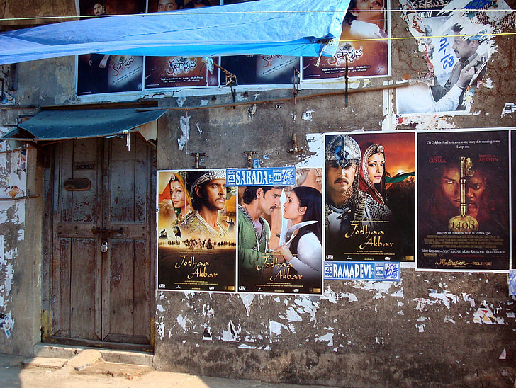 assorted movie poster on wall