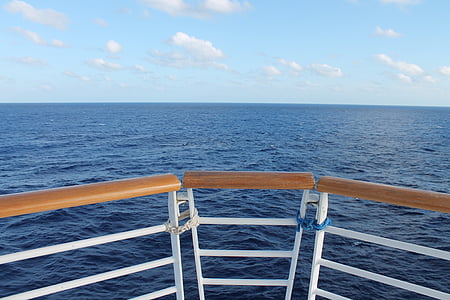 close-up photography of brown and white boat handrails